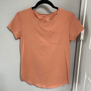Women’s small orange scoop tee by Alpha Forward